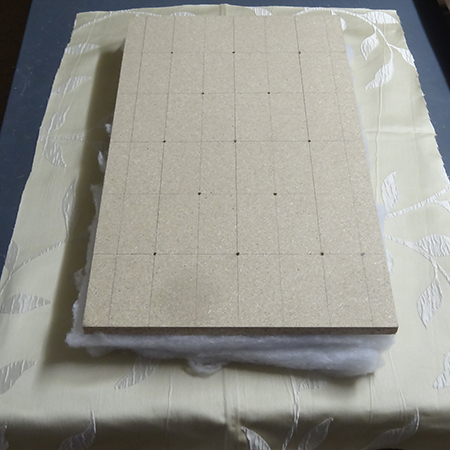 Cheat's diamond-tufted ottoman