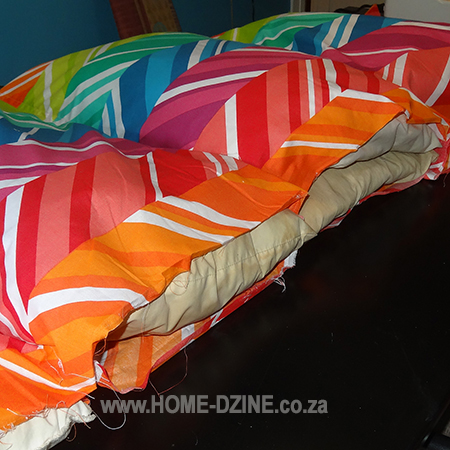 easy colourful outdoor sun lounger with adjustable head rest and stuff with old pillows