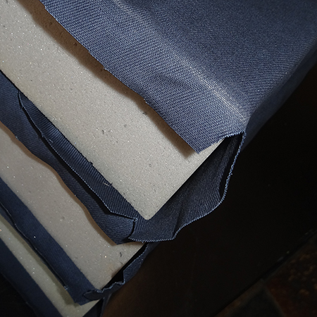 Making upholstered cushions for outdoor sofa cut fabric