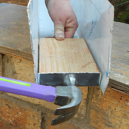 Use a hammer and block of wood to shape the aluminium