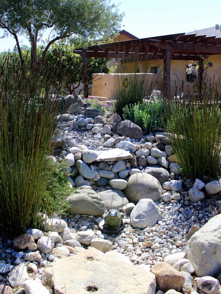 Pebble and rock river bed for garden drainage