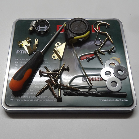 A selection of odds and ends were arranged on top of the lid to cover up the embossed design and make it more personal. Once you are happy with the layout, take a pic to help you remember what goes where, or remove only one section at a time.