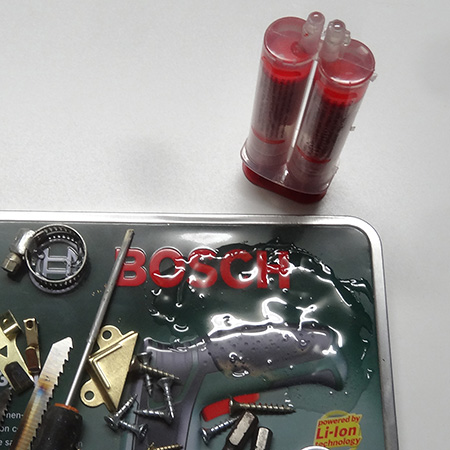 I used 10-minute epoxy glue to attach the items onto the lid, dividing the lid into quarters and working quickly to place the items in the glue before it started to harden.