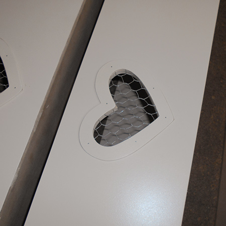 drawers with heart cut out and chicken wire insets