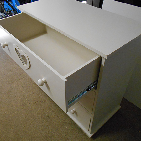 chest of drawers with heart cuts outs and drawer runners