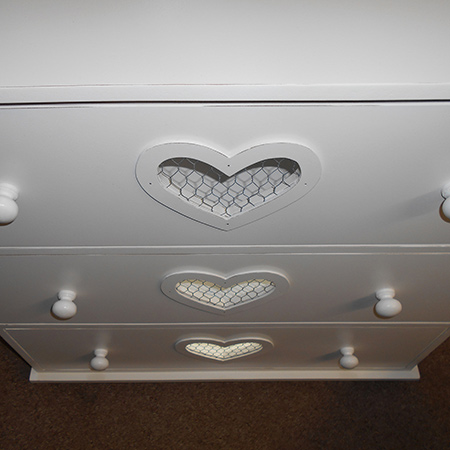 Make a chest of drawers with heart cut out