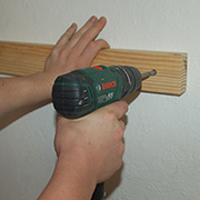 Drill straight holes into walls