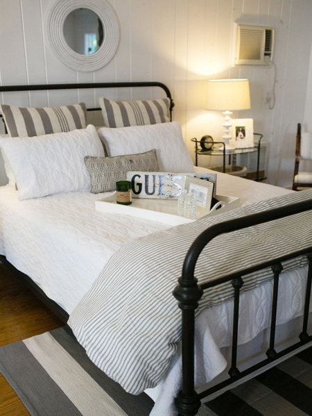 guest bedrooms - A ceiling fitting will provide light for general activities, but bedside lamps cast a soft, soothing light that will allow your guests to move around the room