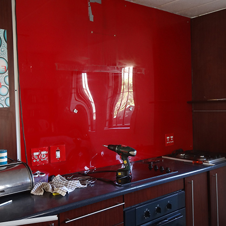 red, black and white checker pattern glass mosaic tile backsplash replaces perspex backsplash