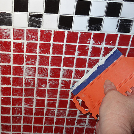 red, black and white checker pattern glass mosaic tile backsplash apply grout