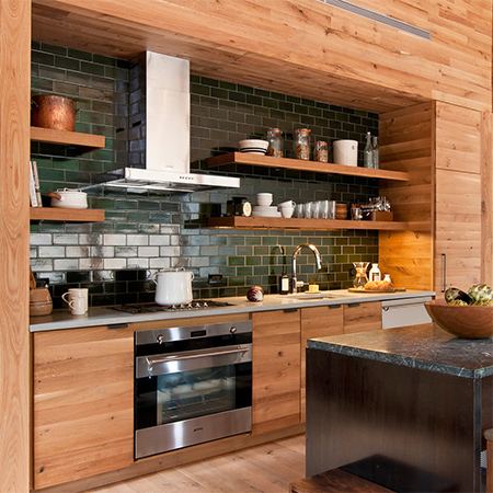 Naturally modern wood homes with wood clad panelling in kitchen