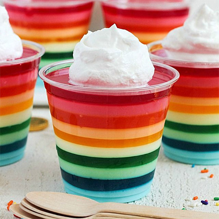 Rainbow jelly colourful party desserts and treats in cups