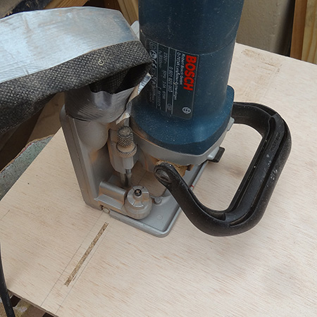 biscuit joiner cuts slots for invisible joins