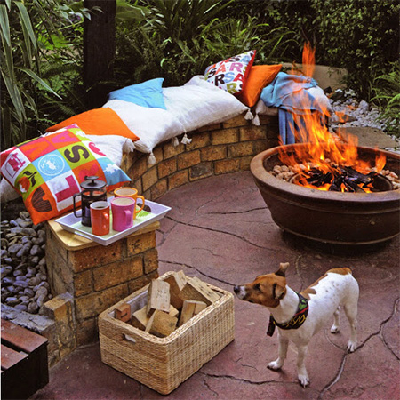 brick seating around firepit for outdoor entertainment area