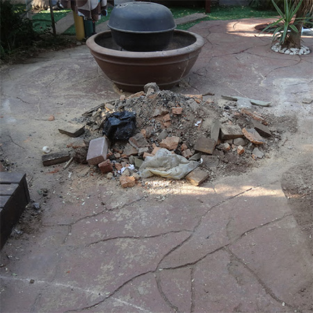 knocking down brick seats for new concrete paved area