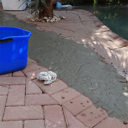 raising level between concrete slab and paving