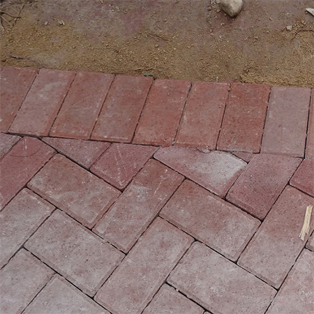concrete paving bricks herringbone pattern with edging