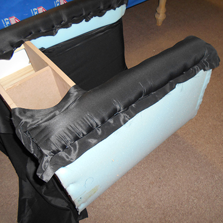 The lining fabric was cut to fit over the front sections of both sides, with plenty of excess fabric at the top, bottom and sides for stapling to the chair frame. 