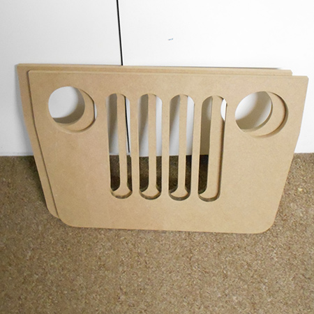 We used a hole saw to drill out perfect circular holes for the headlamps...