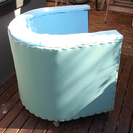 After that, the top and bottom of the foam was stapled to the frame. This may or may not have been necessary but I thought it a necessary measure in case the glue didn't hold the foam in place on its own. Finally, foam was glued to the front armrests.