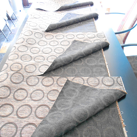 Cutting the fabric was the next step. I opted to use an entire piece of fabric for the sides, over the arms and down the inside of the frame.