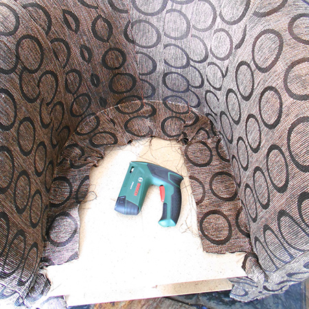 BELOW: The inside fabric is stapled all the way around the seat.