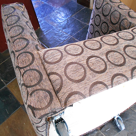 To finish, the cushion was upholstered using a front and continuous side panel and a top and bottom. The top was attached to the side/front section and then the foam cushion inserted and the bottom panel hand sewn in place.