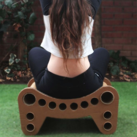 cardboard seat or stool is made using recycled cardboard boxes and tubes