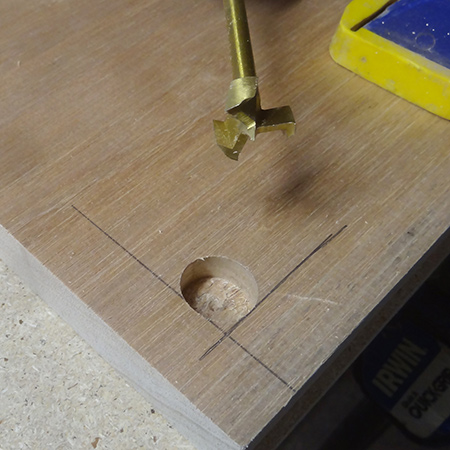 A MAD bit is preferable for drilling the hole, as the tip is not as long as a spade bit.