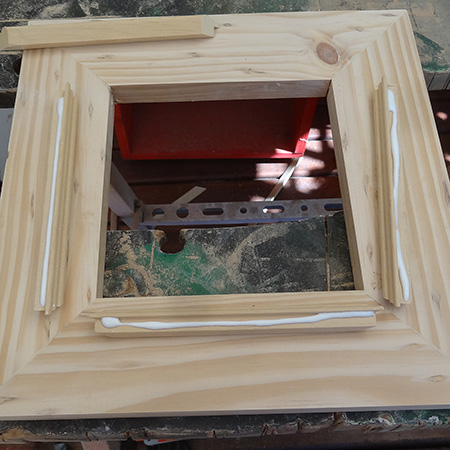 9. Before you glue the moulding in place, do a test fit to make sure the pieces fit snug and tight. Apply wood glue to the moulding and fit to the inside of the frame.&nbsp;