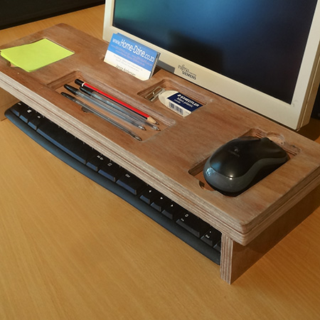 storage holder that fits over a keypad for pens and pencils, notepad and cellphone