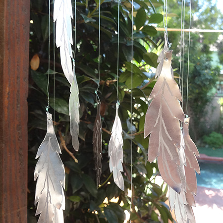 A coffee can becomes a feather wind chime using the Dremel Micro