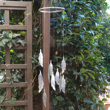 A coffee can becomes a feather wind chime using the Dremel Micro