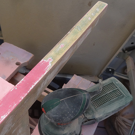 Only sand away the paint and try to prevent sanding the surface of the wood at this stage, as the rough grit sandpaper will damage the surface.