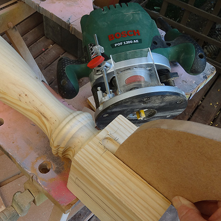 Make a round drop-leaf table with bosch router
