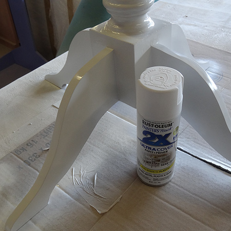 spray table leg or base with rustoleum 2x semi-gloss white
