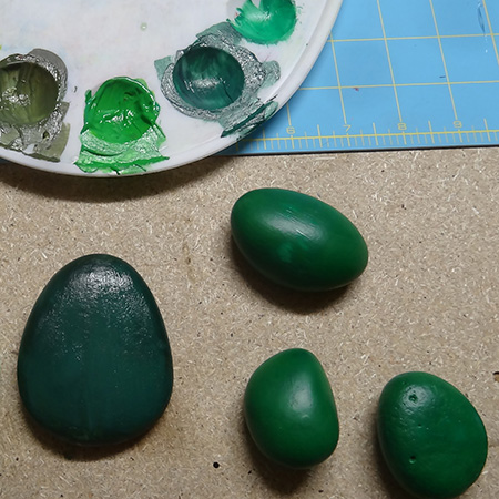 Painted pebbles for colourful cacti display