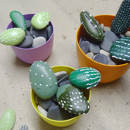 Painted pebbles for colourful cacti display