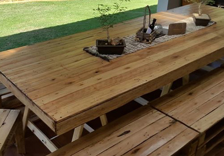 Dining tables and chairs made from reclaimed pallets