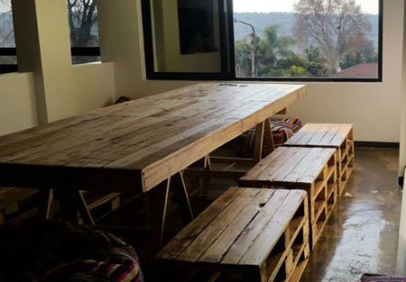 Dining tables and chairs made from reclaimed pallets