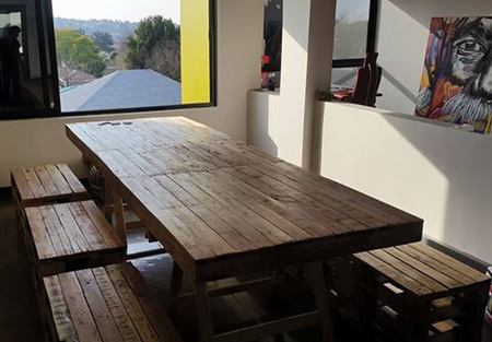 Dining tables and chairs made from reclaimed pallets