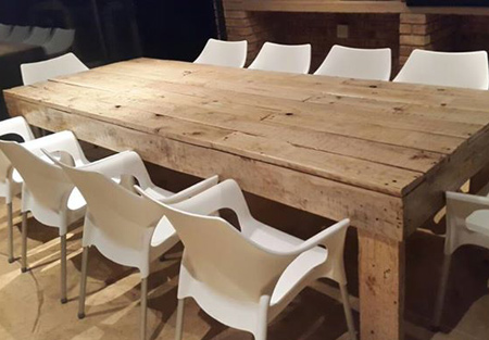 Dining tables and chairs made from reclaimed pallets