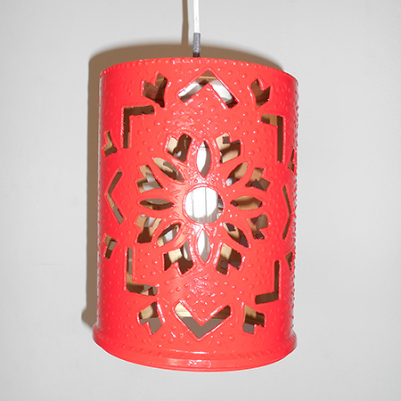 The recycled plastic paint container was given a Moroccan theme to match the artwork