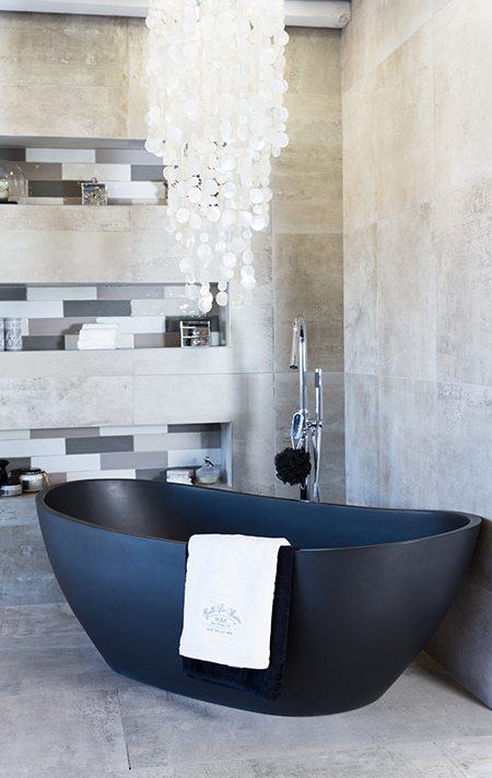 Many homeowners would like to incorporate concrete finishes in a home - without the mess, hassle and cost normally associated with these finishes. A new trend is to use concrete-look tiles.