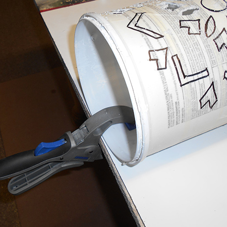 Upcycle a plastic paint container into a trendy pendant lamp