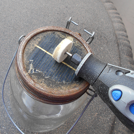1. To clean the top solar panel I dipped the polishing wheel in a solution of dishwashing liquid and warm water and set the Dremel MultiTool on slow to clean away all the built-up grime. Repeat as often as necessary and then wipe dry. 
