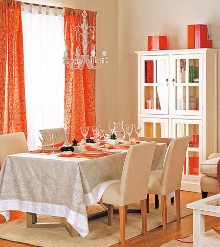 A plain dining room in invigorated and brightened with the additional or bold, patterned curtains with accessories in similar hues