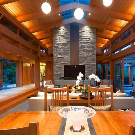The lower level has high ceilings with exposed beams and a continuous skylight along the full length of the living areas. An expansive space incorporates the living, dining room and open kitchen.