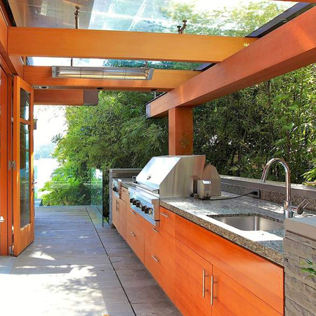 A fully fitted outdoor kitchen provides all the necessary mod cons for extended outdoor entertaining and relaxation.