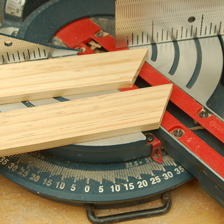 1. Cut a 30-degree angle at the top of bottom of the 4 legs. These will ensure that the play frame sits flat on the floor. To cut the angles you can use a mitre box and saw, or a mitre saw. 